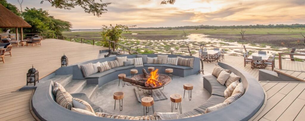 Luxury vs. Budget Safaris: Which One is Right for You? 7 BANNER Zambia SouthLuangwa KafuntaRiverLodge FirePit 1200x479 1